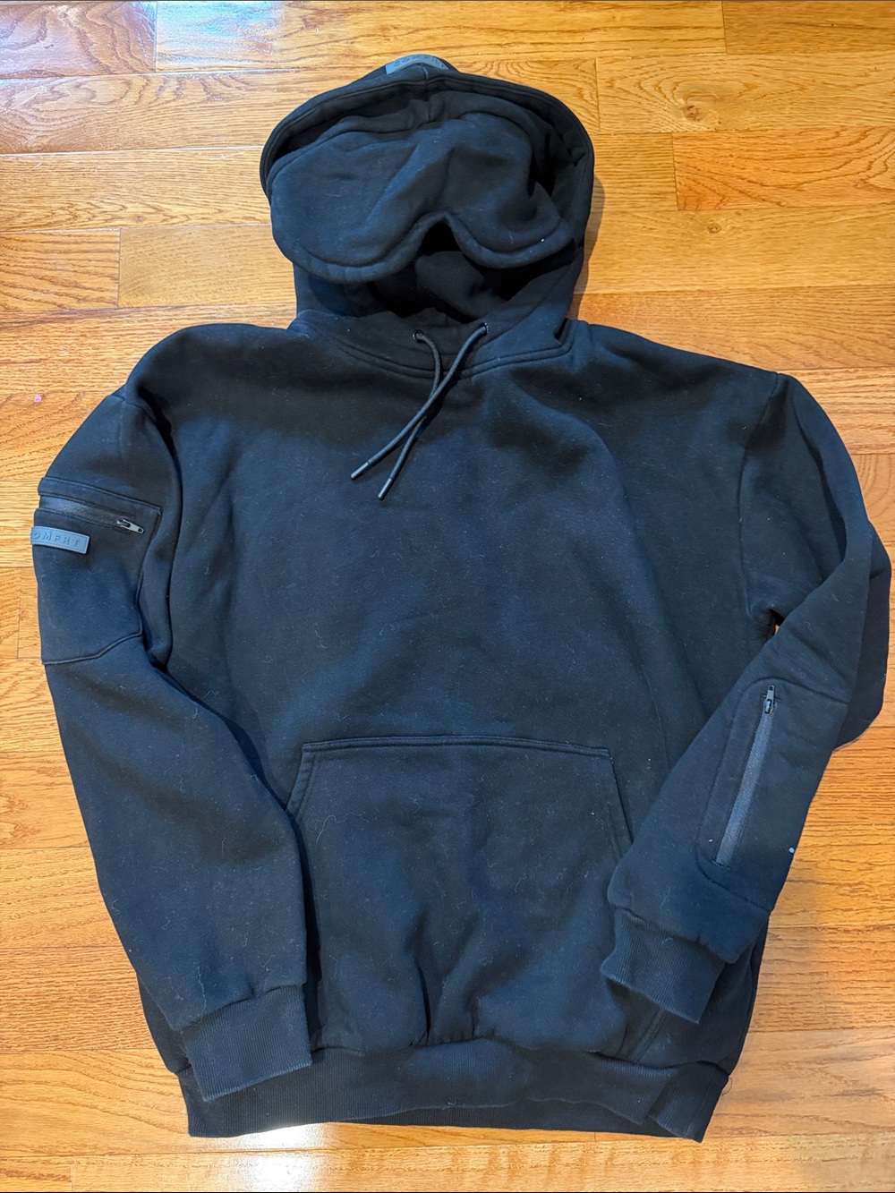 Comfrt Black Hooded Pullover with Eye Mask and Zip Sleeve Pockets Airplane Mode